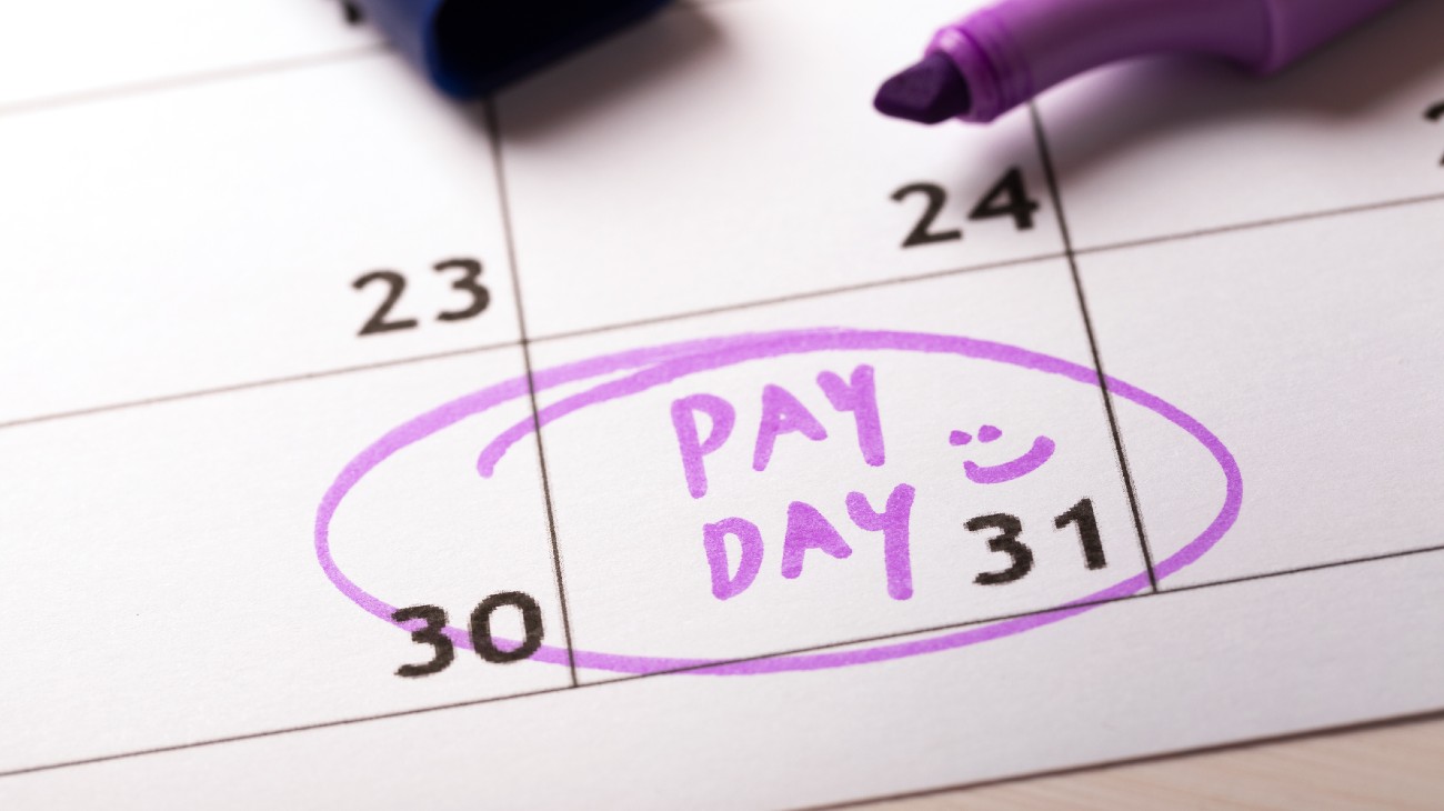 payday concept calendar with marker and circled day of salary make payroll more efficient